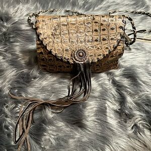 Handmade leathered crossbody.